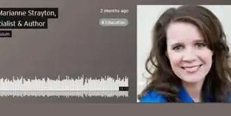 A woman is recording her face with headphones.